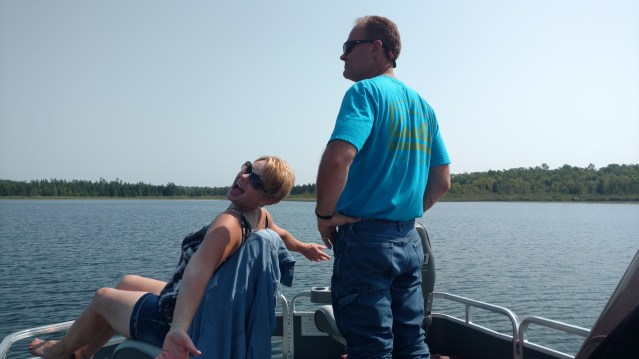 Author's couple friends goofing around in the pontoon.