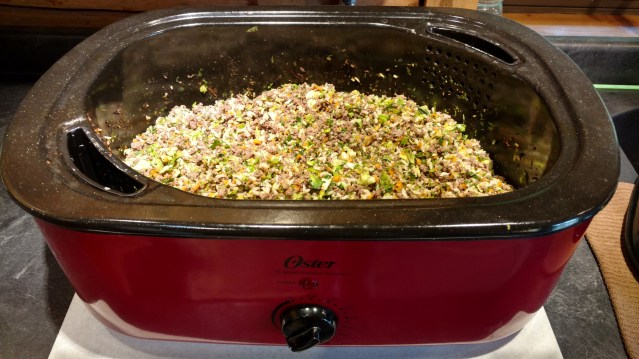 An electric roaster full of homemade dog food by the author.