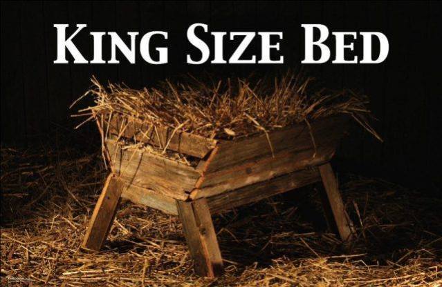 Image of an empty, readied manger with the words King Size Bed across the top.