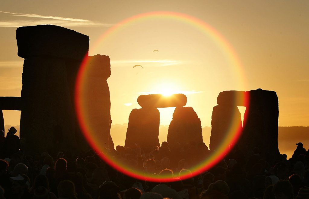 view of the sunrise through Stonehenge